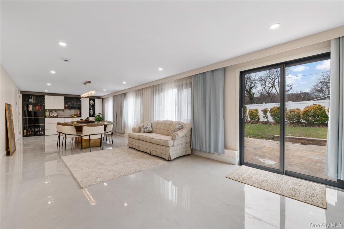 2 Elf Road Syosset, NY 11791 - Photo 12 of 38 a living room with furniture and large window
