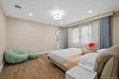 a bathroom with a granite countertop sink a toilet and shower