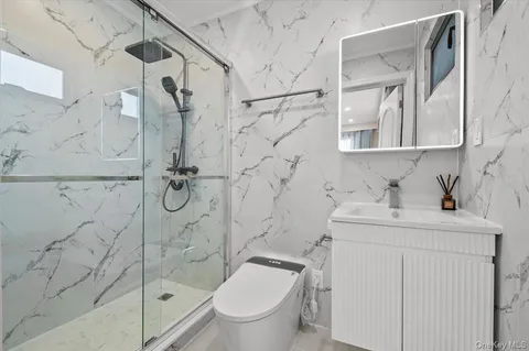 a white bath tub sitting next to a white sink