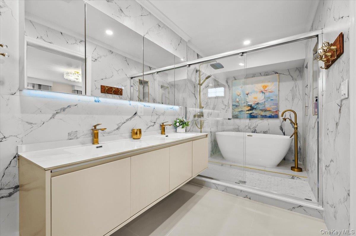 2 Elf Road Syosset, NY 11791 - Photo 27 of 38 a white bath tub sitting next to a white sink