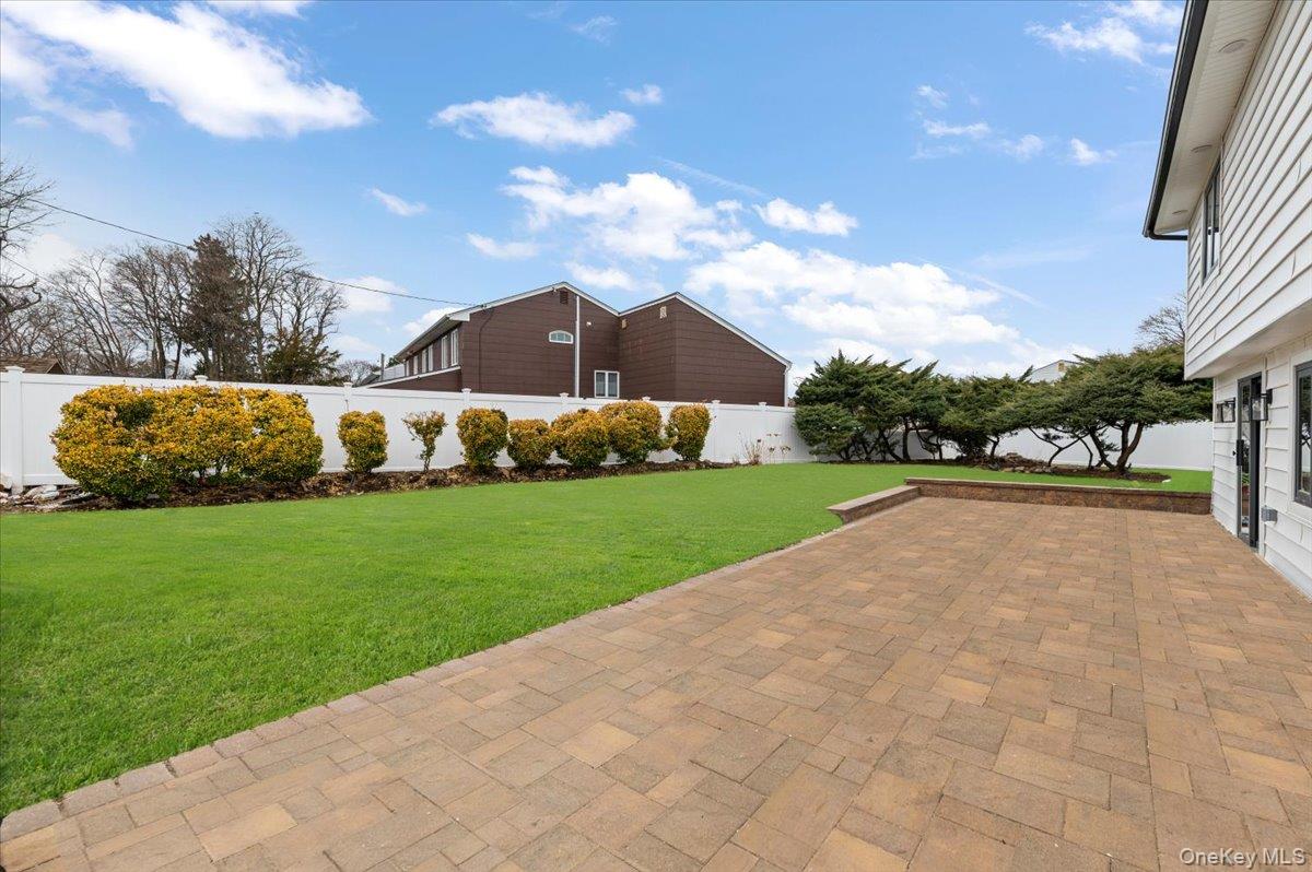 2 Elf Road Syosset, NY 11791 - Photo 33 of 38 a view of yard with swimming pool and green space