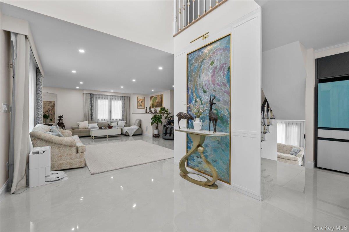 2 Elf Road Syosset, NY 11791 - Photo 4 of 38 a living room with furniture and a painting on the wall