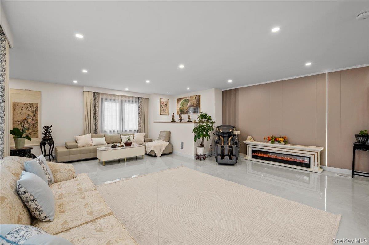 2 Elf Road Syosset, NY 11791 - Photo 8 of 38 a living room with furniture and wooden floor