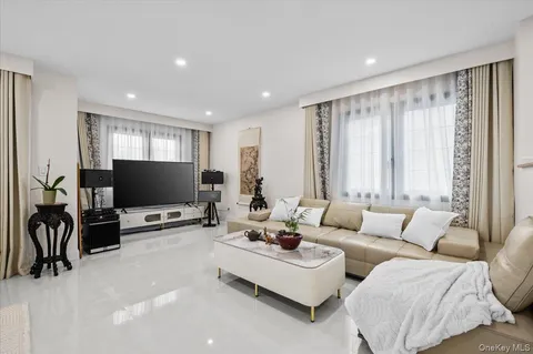 a living room with furniture and large window