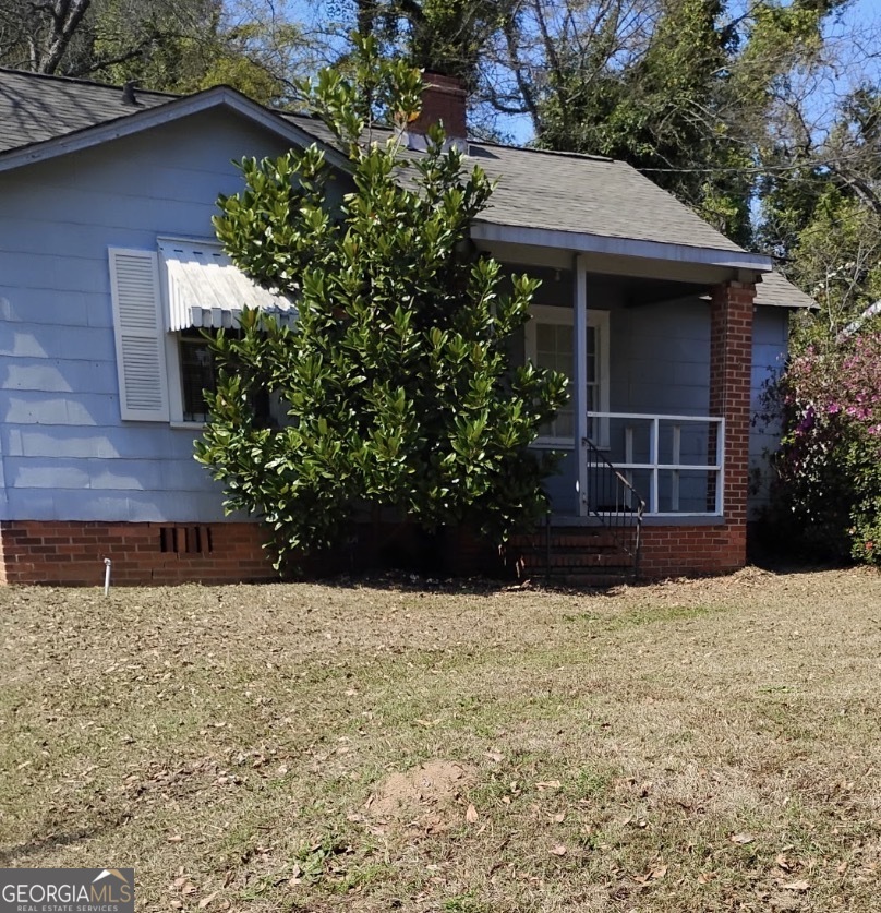 3423 Flamingo Drive Macon, GA 31206 - Photo 1 of 6 a front view of a house with a yard