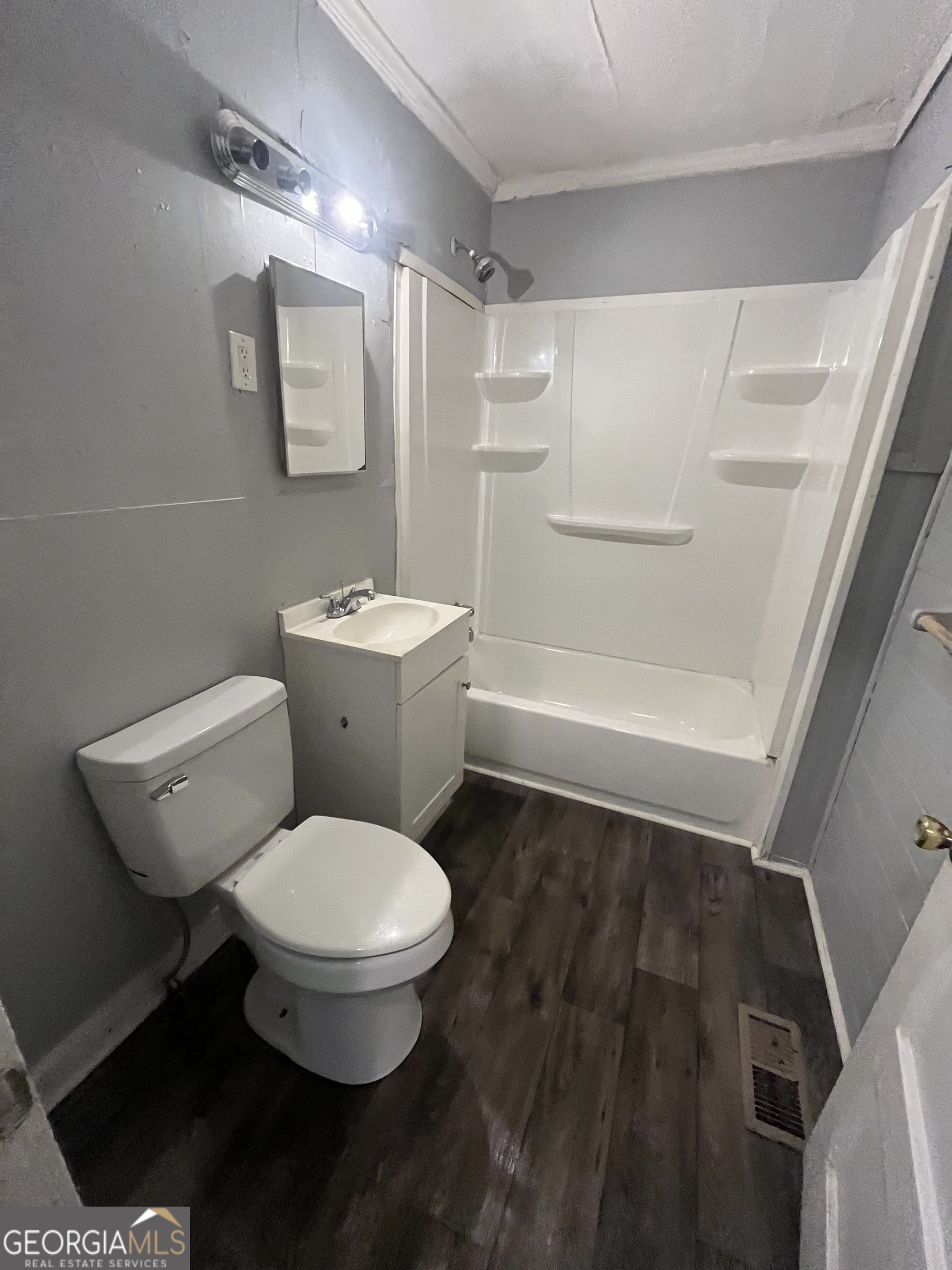 3423 Flamingo Drive Macon, GA 31206 - Photo 3 of 6 a bathroom with a toilet and a shower
