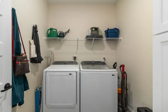 a view of storage and utility room with washer and dryer