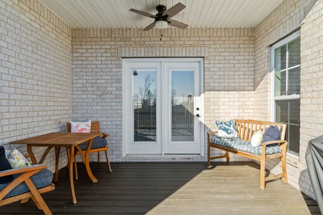 a balcony with table and chairs