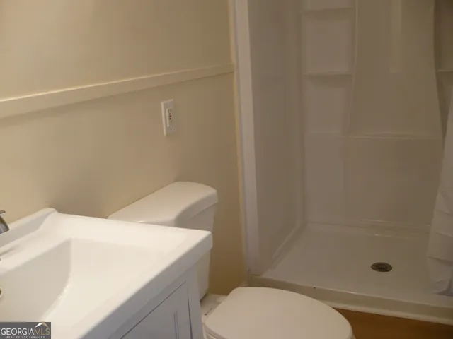 a bathroom with a sink and toilet