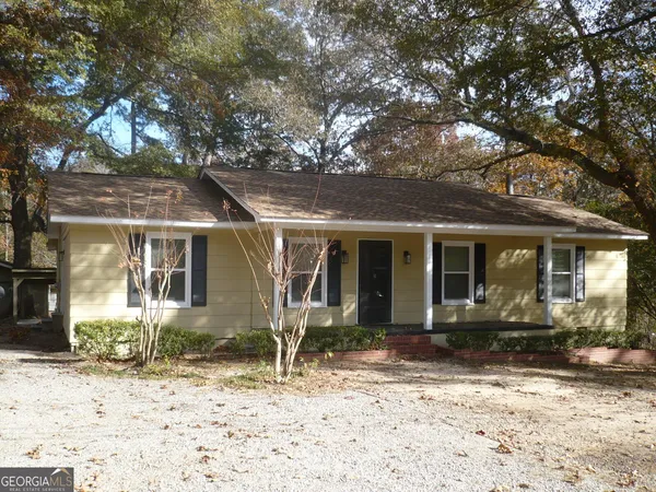 a front view of a house with a porch