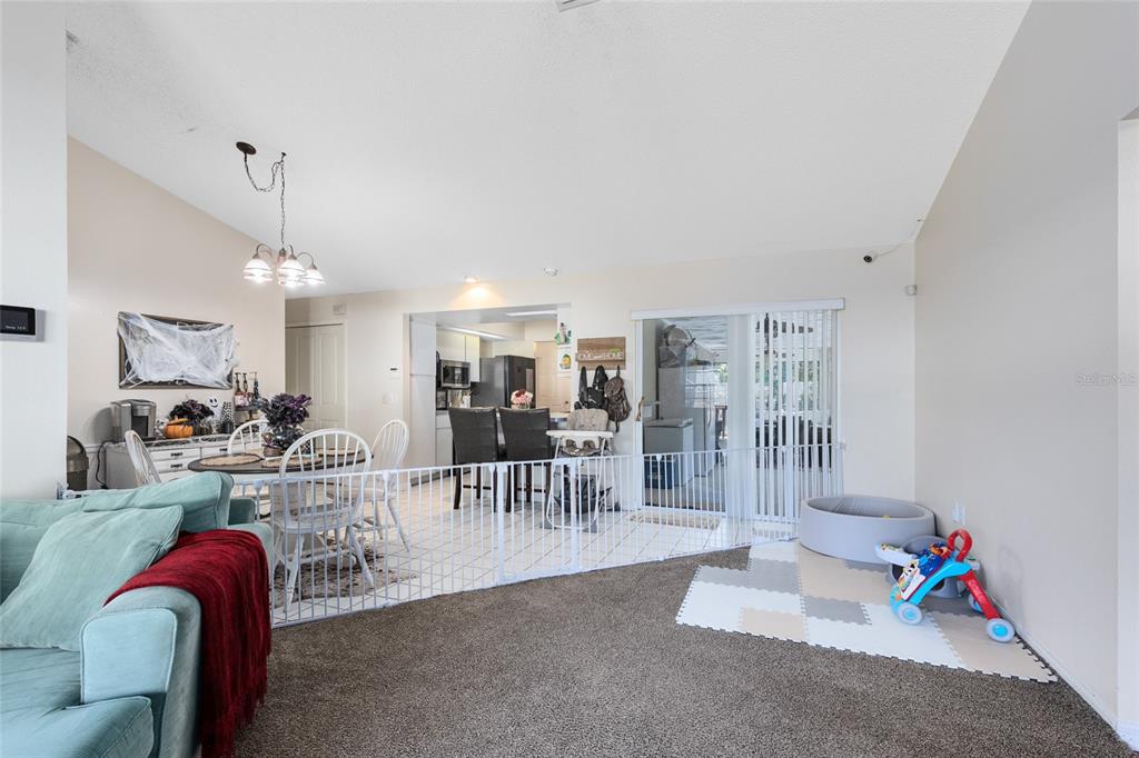 130 Laurianne Road DeBary, FL 32713 - Photo 14 of 34 a living room with furniture and a chandelier
