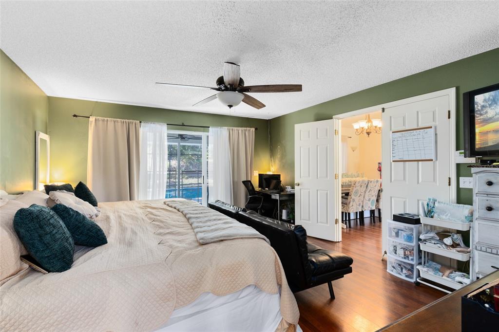 130 Laurianne Road DeBary, FL 32713 - Photo 16 of 34 a bedroom with a bed a couch and a large window