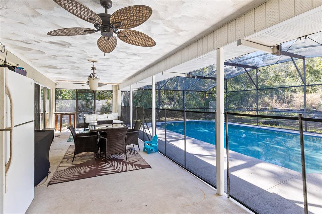 130 Laurianne Road DeBary, FL 32713 - Photo 25 of 34 a work room with glass door and furniture