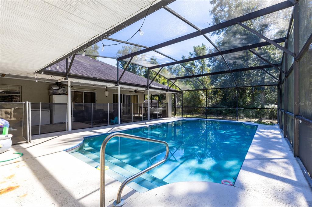 130 Laurianne Road DeBary, FL 32713 - Photo 26 of 34 a view of a swimming pool with a patio