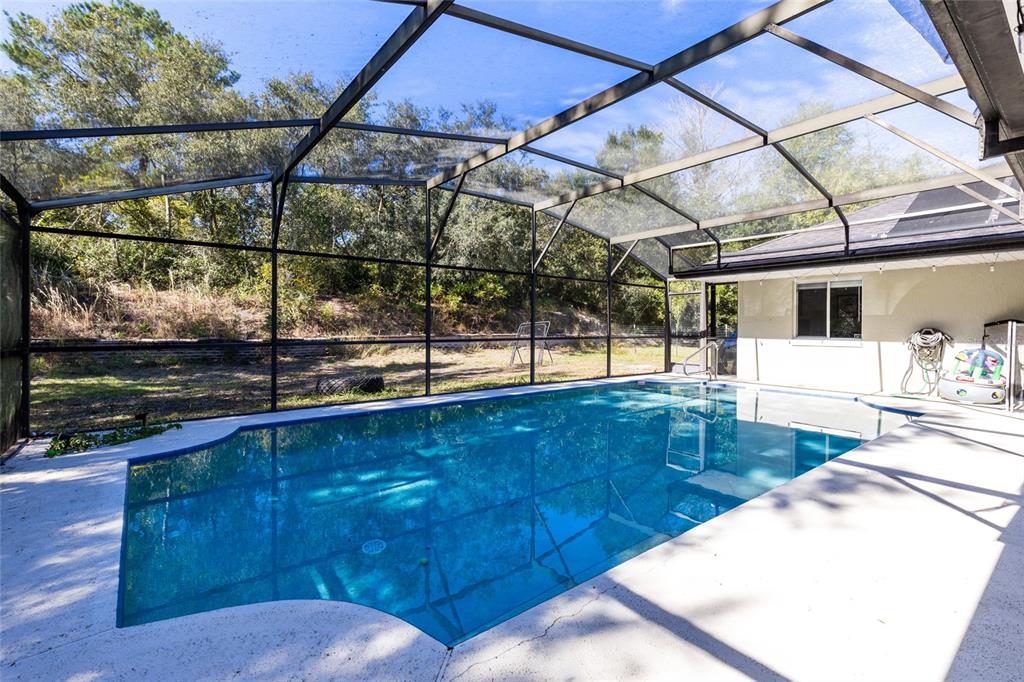 130 Laurianne Road DeBary, FL 32713 - Photo 28 of 34 a view of a swimming pool with a patio