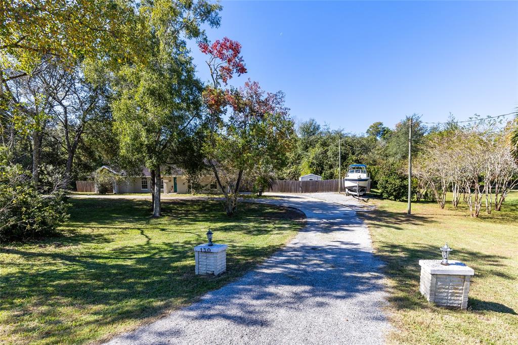 130 Laurianne Road DeBary, FL 32713 - Photo 5 of 34 a view of a backyard with swimming pool