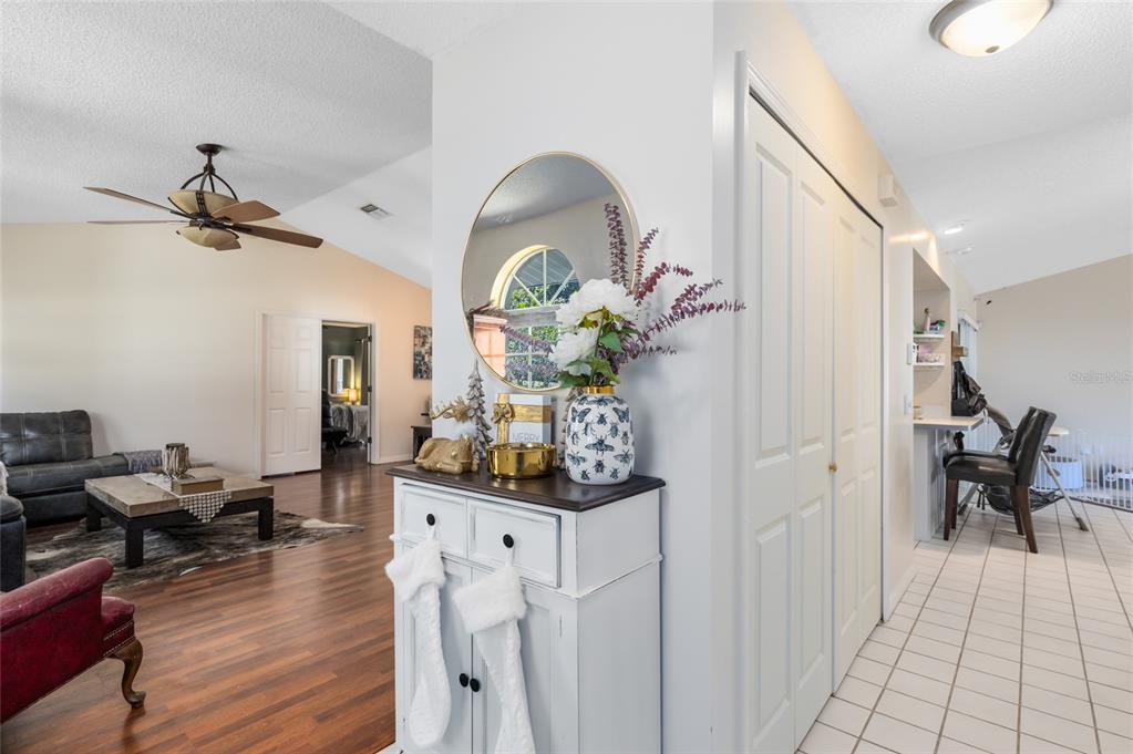 130 Laurianne Road DeBary, FL 32713 - Photo 6 of 34 a living room with furniture flowerpot and wooden floor
