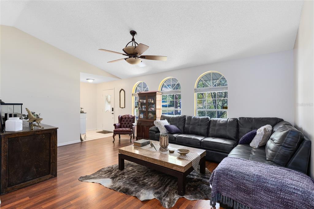 130 Laurianne Road DeBary, FL 32713 - Photo 7 of 34 a living room with furniture and wooden floor
