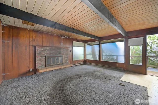 a view of an empty room with a fireplace