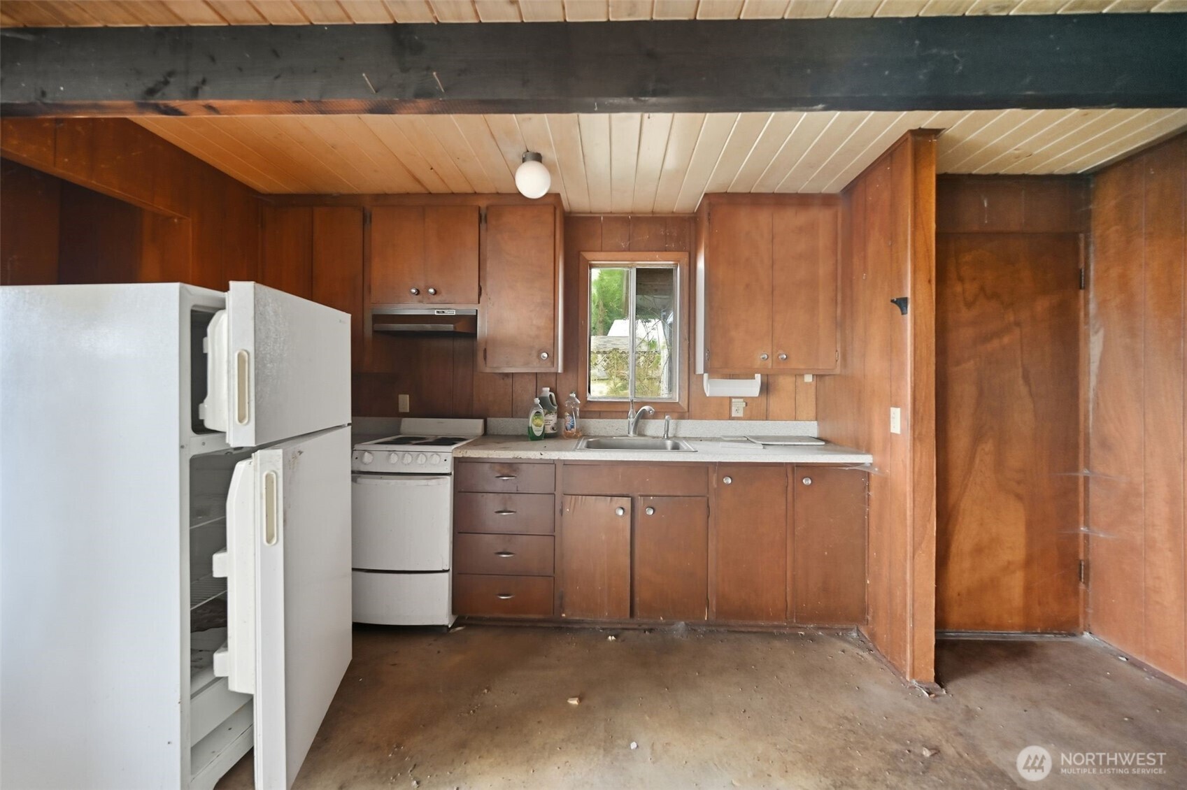 1284 Dines Point Road Greenbank, WA 98253 - Photo 16 of 23 a kitchen with refrigerator and cabinets