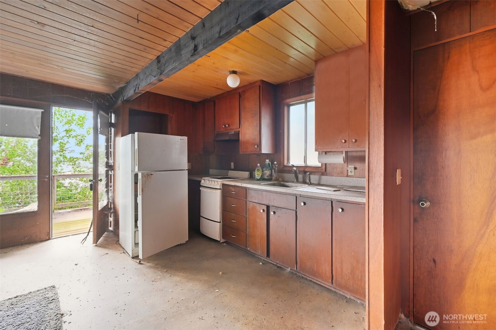 1284 Dines Point Road Greenbank, WA 98253 - Photo 17 of 23 a kitchen with refrigerator and window