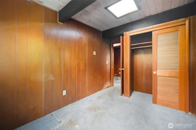 a view of an empty room with wooden door