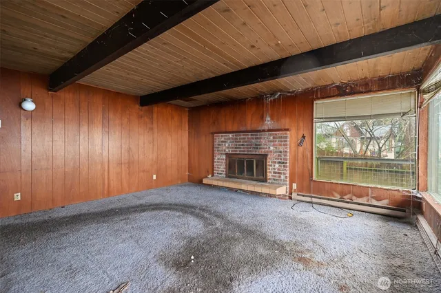 a view of an empty room with a fireplace