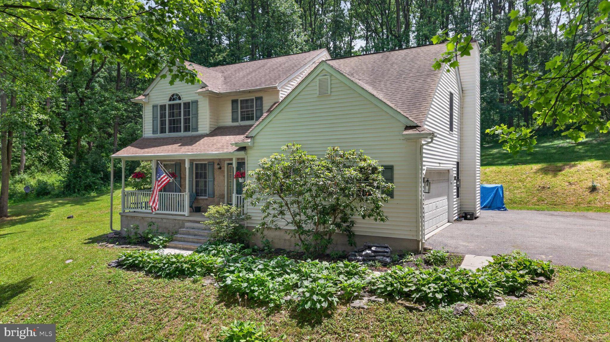 802 Hollow Road Delta, PA 17314 - Photo 3 of 45 Charming home nestled in lush greenery.