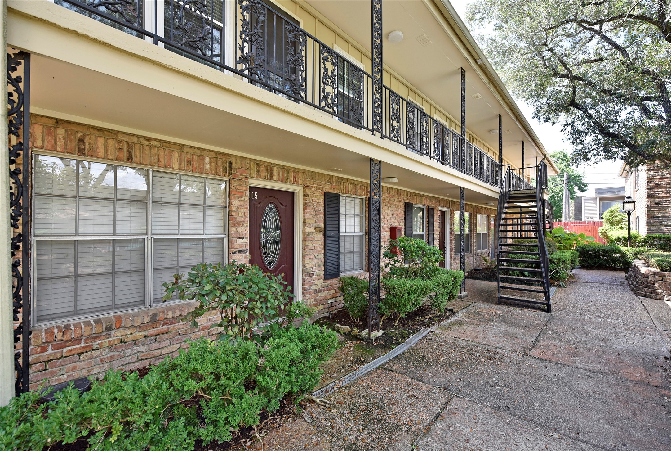3224 Timmons Lane, Unit 112 Houston, TX 77027 - Photo 7 of 30 a view of a building next to a yard