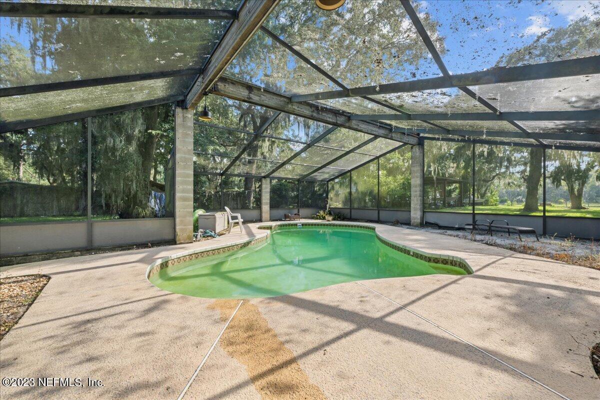 7145 Fitzpatrick Lane Jacksonville, FL 32226 - Photo 18 of 42 a view of a house with backyard and porch