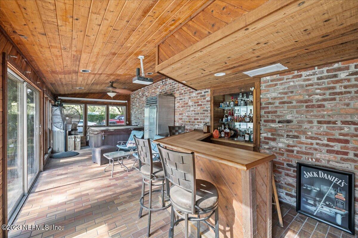 7145 Fitzpatrick Lane Jacksonville, FL 32226 - Photo 20 of 42 a view of a dining room with furniture window and outside view