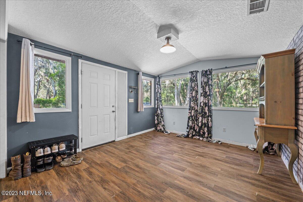 7145 Fitzpatrick Lane Jacksonville, FL 32226 - Photo 32 of 42 a bed room with a bed and a window