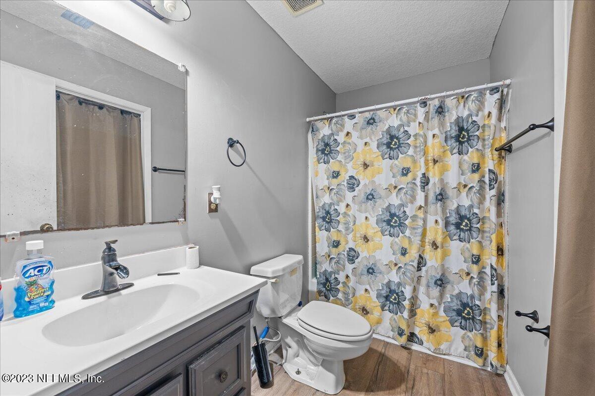 7145 Fitzpatrick Lane Jacksonville, FL 32226 - Photo 34 of 42 a bathroom with a sink toilet and shower