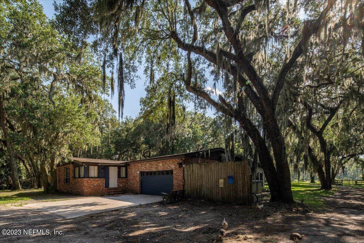 7145 Fitzpatrick Lane Jacksonville, FL 32226 - Photo 40 of 42 a front view of a house with a yard