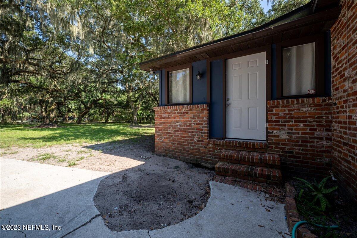 7145 Fitzpatrick Lane Jacksonville, FL 32226 - Photo 41 of 42 a view of a house with a yard