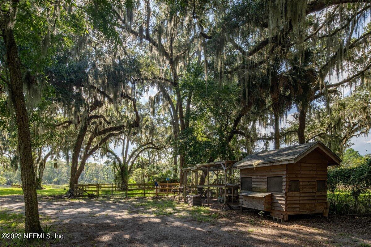 7145 Fitzpatrick Lane Jacksonville, FL 32226 - Photo 5 of 42 a front view of a house with a yard