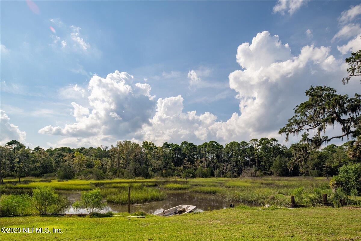 7145 Fitzpatrick Lane Jacksonville, FL 32226 - Photo 7 of 42 a view of a golf course with a lake