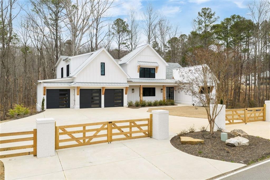 555 Lower Birmingham Road Canton, GA 30115 - Photo 2 of 104 a front view of a house with a yard