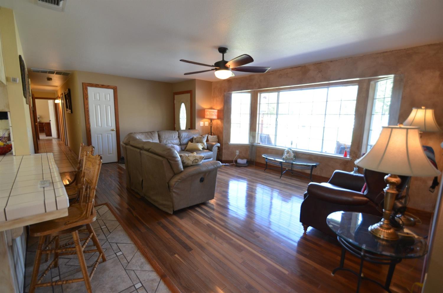 7453 Live Oak Drive Sanger, CA 93657 - Photo 11 of 28 a living room with furniture and a large window