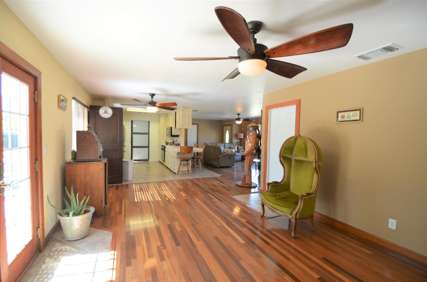 7453 Live Oak Drive Sanger, CA 93657 - Photo 13 of 28 a living room with furniture and a wooden floor