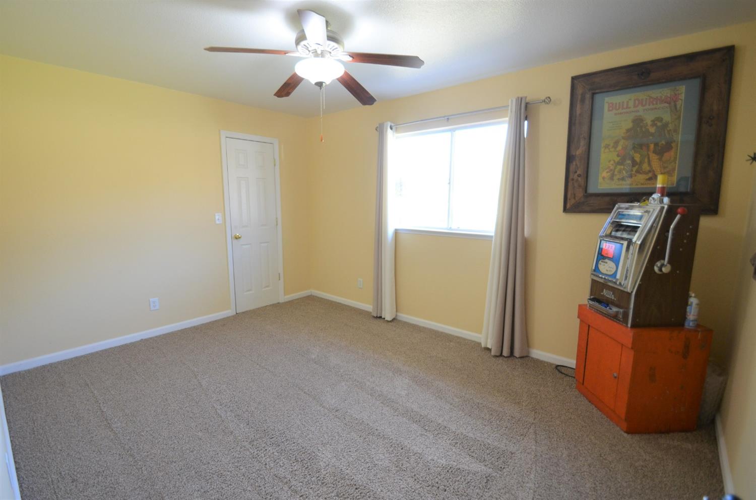 7453 Live Oak Drive Sanger, CA 93657 - Photo 19 of 28 an empty room with windows and closet