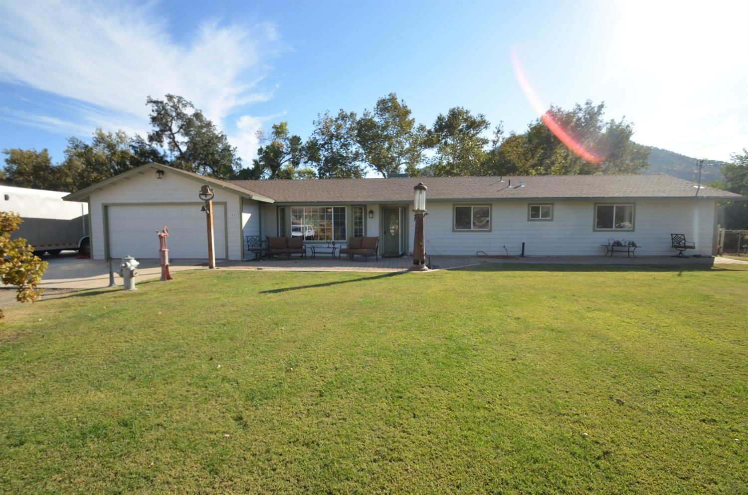 7453 Live Oak Drive Sanger, CA 93657 - Photo 3 of 28 a front view of house with yard and trees