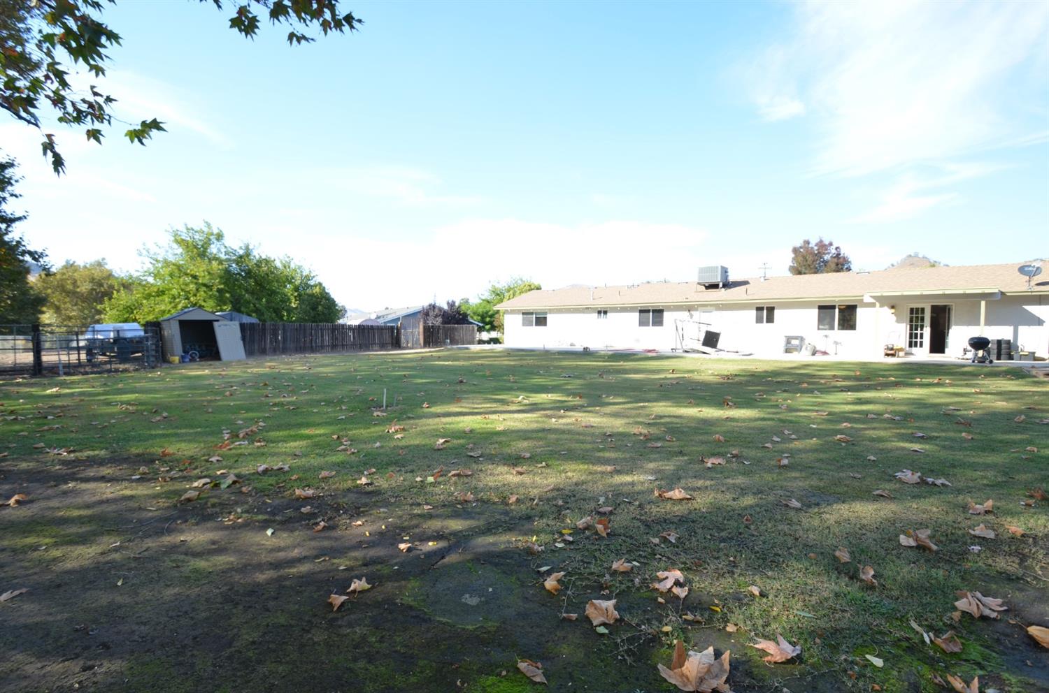 7453 Live Oak Drive Sanger, CA 93657 - Photo 23 of 28 a view of a yard with swimming pool
