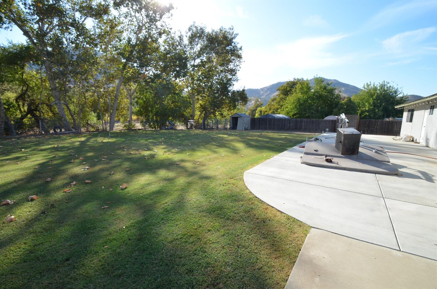7453 Live Oak Drive Sanger, CA 93657 - Photo 24 of 28 a view of a house with a big yard