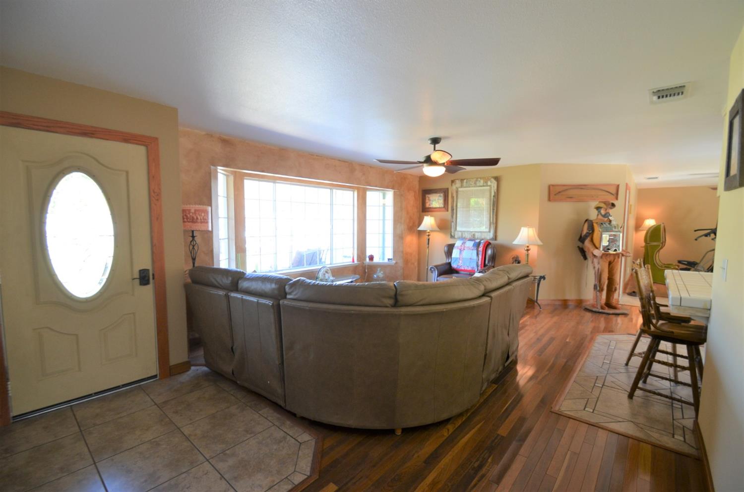 7453 Live Oak Drive Sanger, CA 93657 - Photo 4 of 28 a living room with furniture and a large mirror