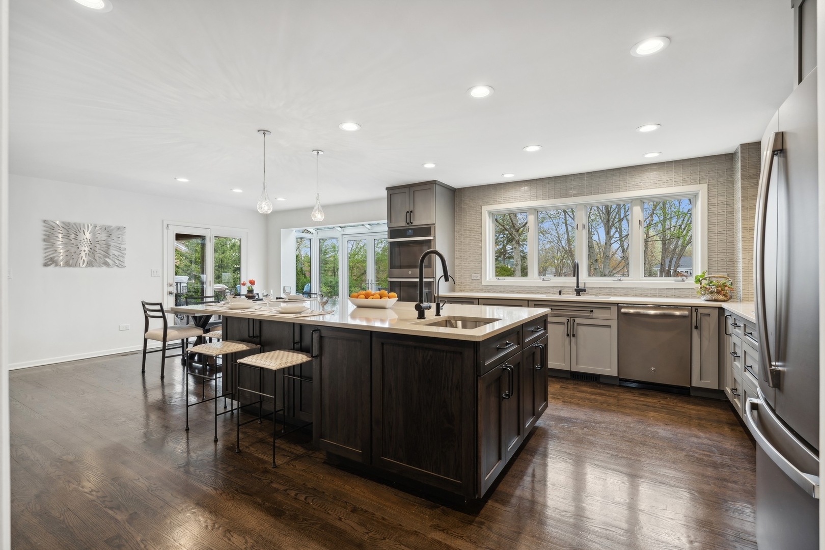 3606 Lawson Road Glenview, IL 60026 - Photo 11 of 62 a kitchen with stainless steel appliances granite countertop sink stove top oven and cabinets