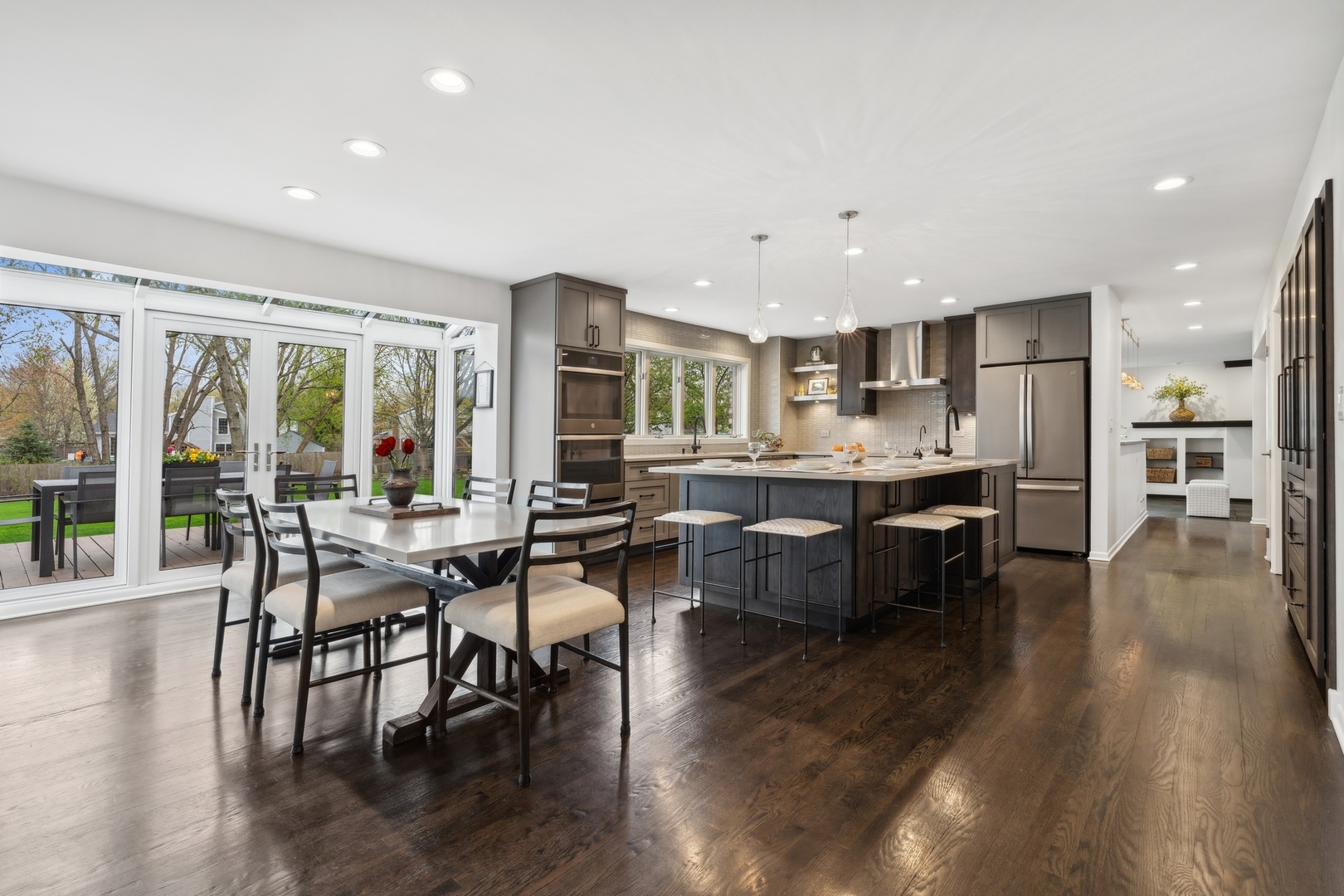 3606 Lawson Road Glenview, IL 60026 - Photo 18 of 62 a living room with stainless steel appliances kitchen island hardwood floor and a kitchen view