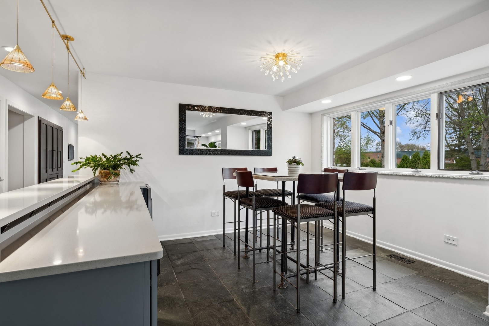 3606 Lawson Road Glenview, IL 60026 - Photo 20 of 62 a view of a dining room with furniture a livingroom and chandelier