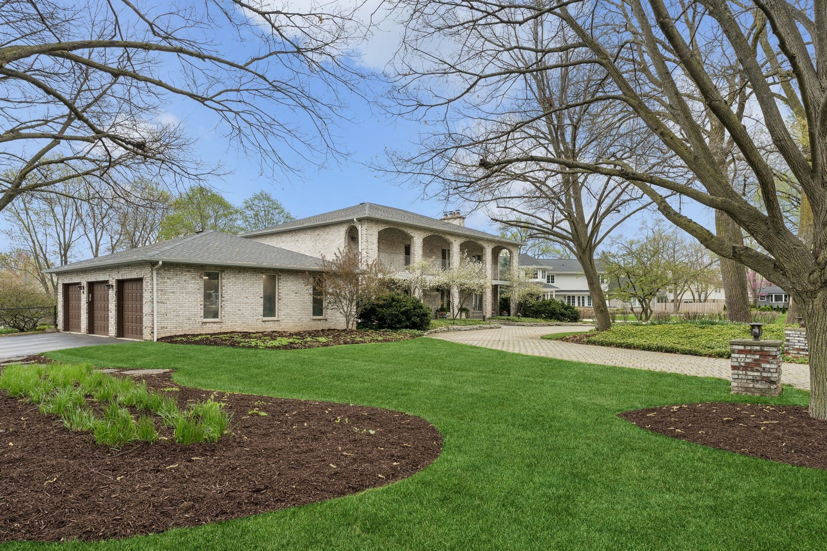 3606 Lawson Road Glenview, IL 60026 - Photo 2 of 62 a front view of a house with garden