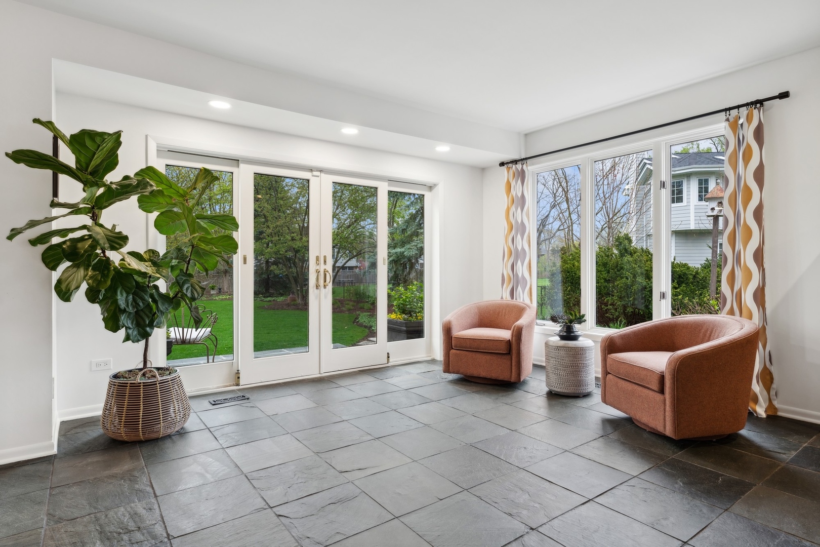 3606 Lawson Road Glenview, IL 60026 - Photo 22 of 62 a living room with furniture and a large window with garden view